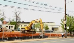 A bulldozer prepares the site at the corner of 4th and Preston April 20.
