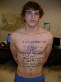 Tobey reveals the words of the Fourth Amendment on his chest during a December visit to the Richmond International Airport.