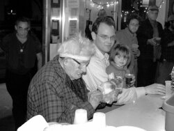Tapscott opens gifts at his 80th birthday party at the Blue Moon Diner in 2003.
