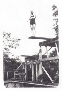 A diver prepares to take the plunge in 1927.
